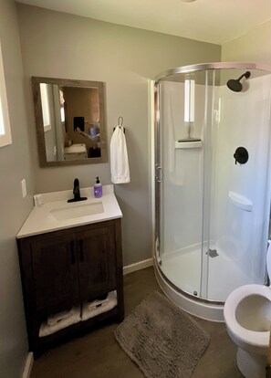Combined shower/bathtub, hair dryer, towels, soap - Family‑Friendly Bungalow & Bunk House • Sleeps 10 • Steps from Priest Lake (Nordman)