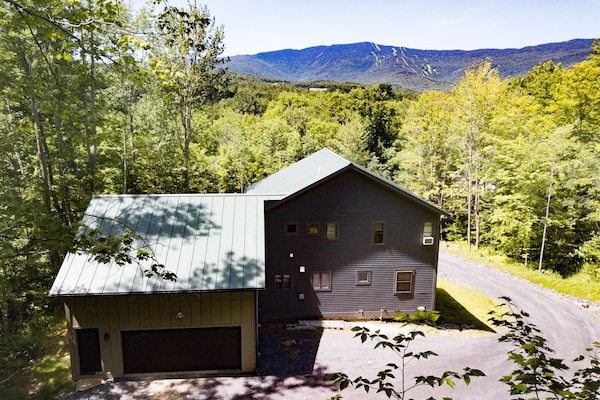 View of the property from the back - looking at the green mountains/ sugarbush