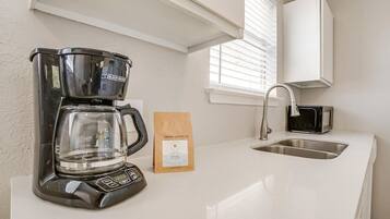 Coffee/tea maker, fridge, microwave, oven