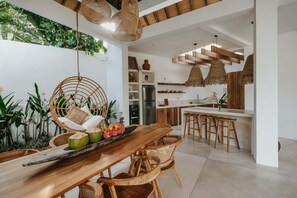 Luxury Villa | Private kitchen | Full-size fridge, stovetop, cookware/dishes/utensils, dining tables - MODJO Villas Bingin (Pecatu)