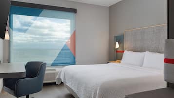 Hypo-allergenic bedding, desk, laptop workspace, blackout curtains