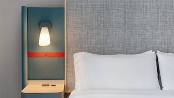 Hypo-allergenic bedding, desk, laptop workspace, blackout curtains