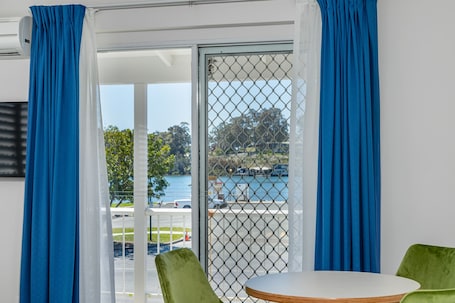 Riverview Suite | Premium bedding, blackout drapes, iron/ironing board, free WiFi