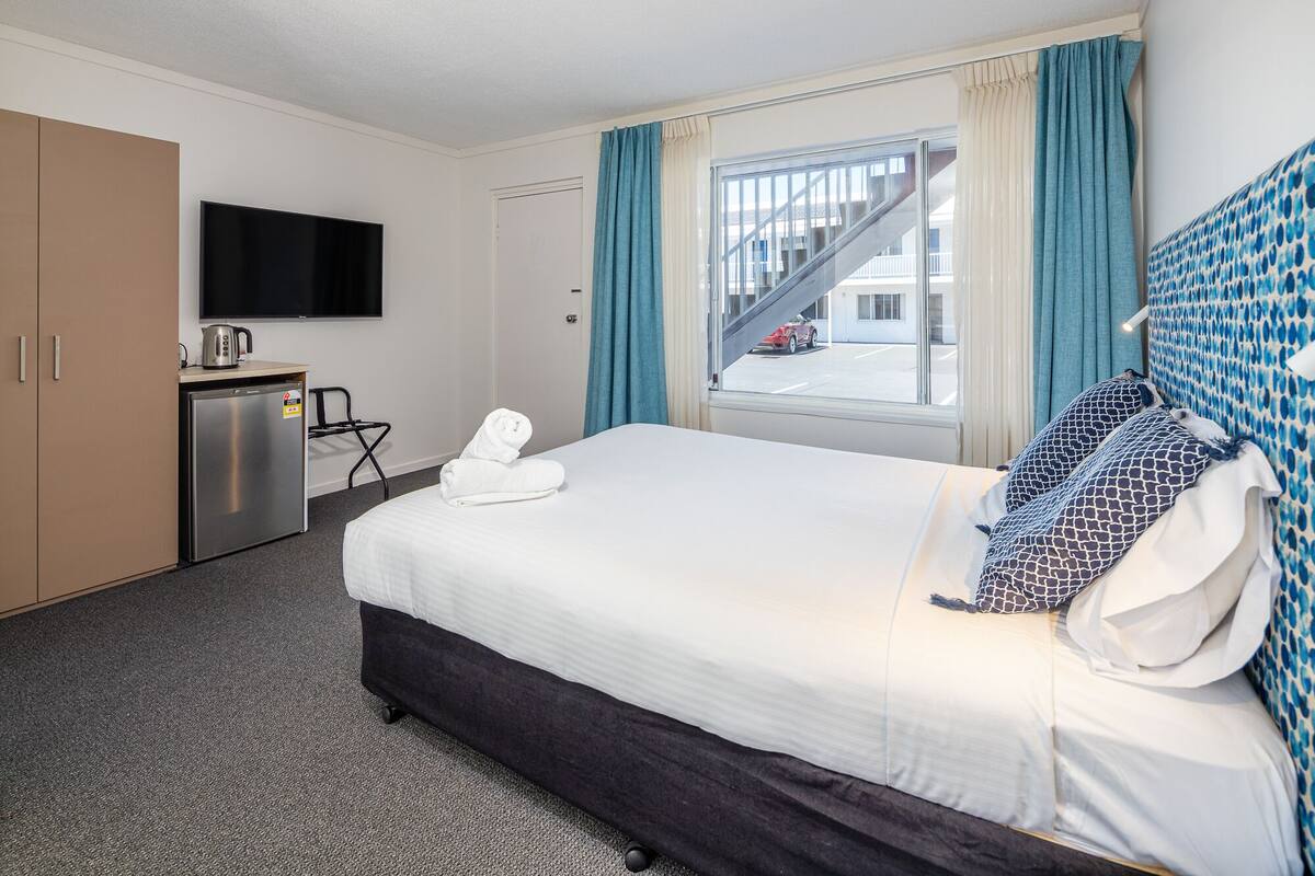 queen room | premium bedding, blackout curtains, iron/ironing board, free wifi