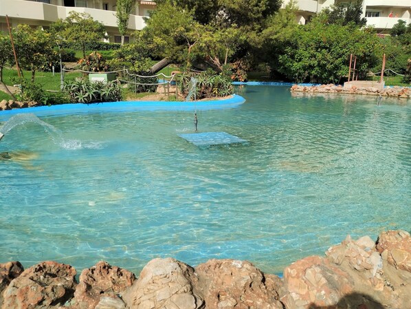 A heated pool, pool loungers