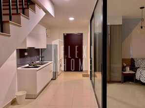 Deluxe Duplex | Private kitchen | Full-size fridge, stovetop, electric kettle, cookware/dishes/utensils