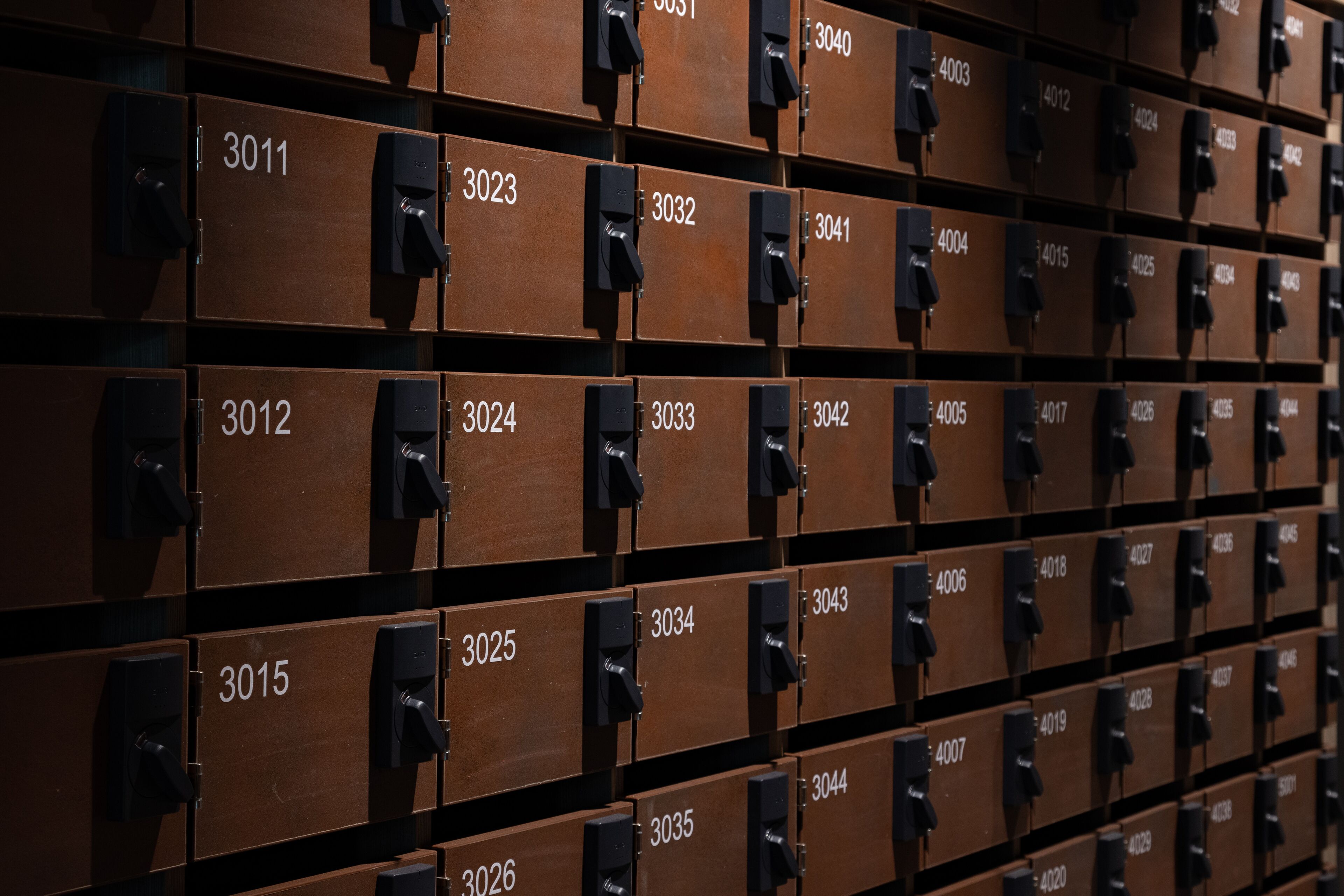 A wall of numbered storage boxes, likely for mail or inventory.