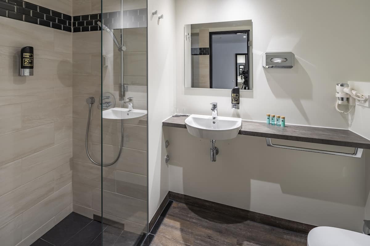 junior double room | bathroom | shower, hair dryer, towels, soap