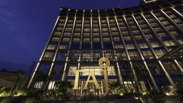 A modern building with a prominent 'TAJ' logo at the entrance, surrounded by well-maintained landscaping. - Taj Lakefront Bhopal (Bhopal)