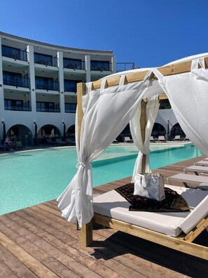 Indoor pool, outdoor pool, pool umbrellas, sun loungers
