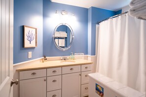 Combined shower/bathtub, hair dryer, towels, soap