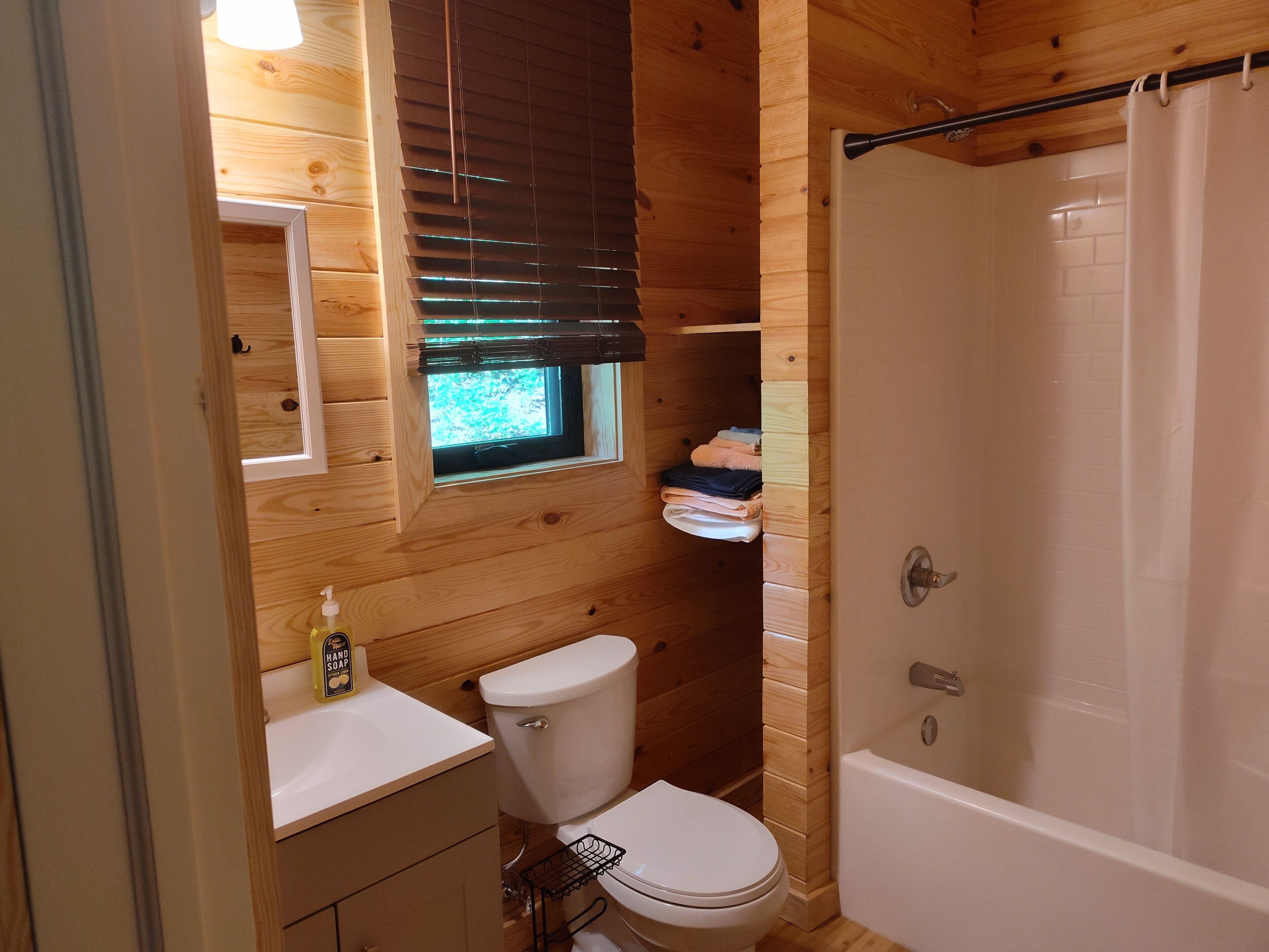 Combined shower/bathtub, hair dryer, towels, soap