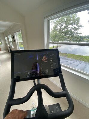Exercise in style with a stationary bike featuring a digital display and convenient water bottle holder.