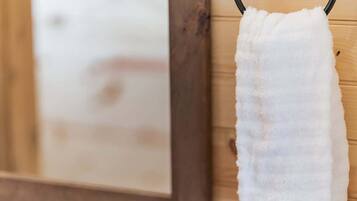 Shower, hair dryer, towels, shampoo
