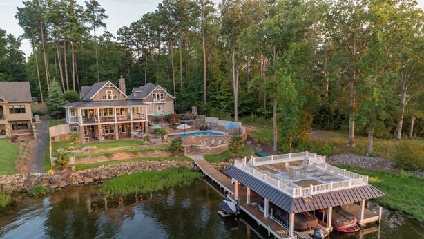 A lakeside property with a dock, a swimming pool, and a large house with multiple decks. - The Oasis at Lake Gaston - Heated Pool, Hot Tub, Pontoon Boat Rental Included! (Littleton)