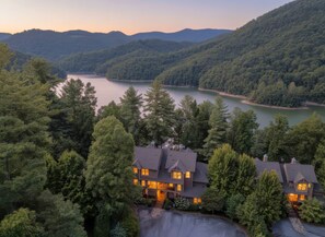 A large house with multiple bedrooms, a driveway, and a lake view. - 65 Southshore Drive Lodge 3 at Bear Lake Reserve (Tuckasegee)