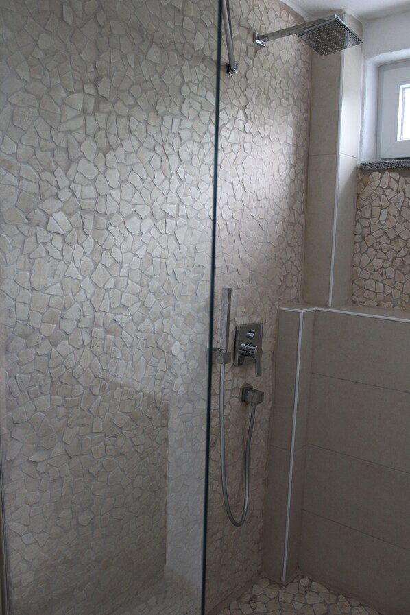 Bathtub, hair dryer, towels, soap