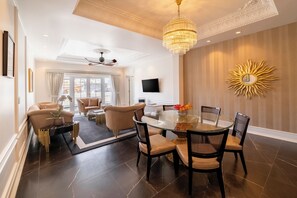 Presidential Suite (La Grande) | Living area | 55-inch LED TV with digital channels, TV, books