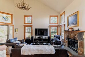 Smart TV, fireplace, foosball, books