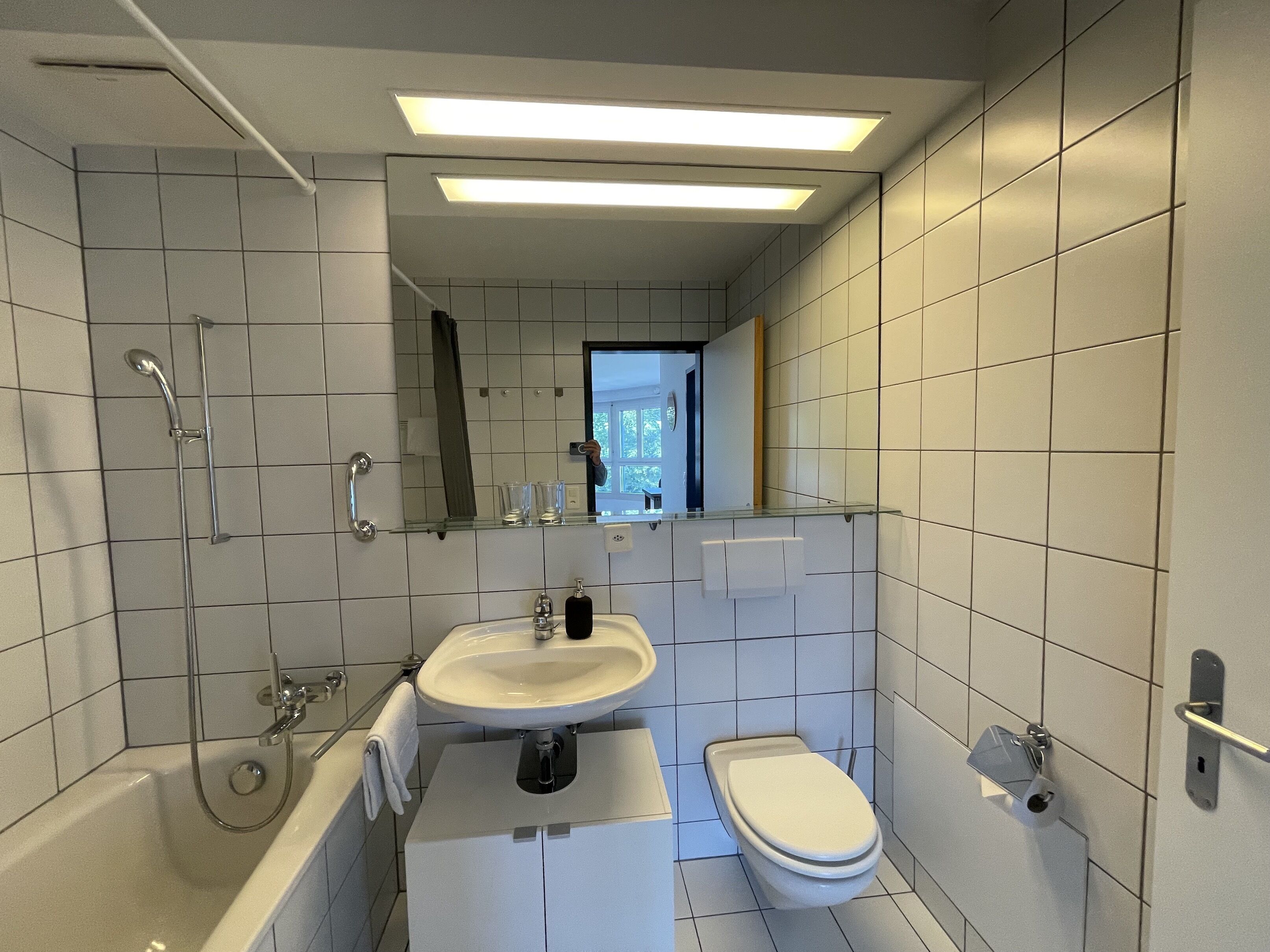 Combined shower/tub, hair dryer, towels, soap