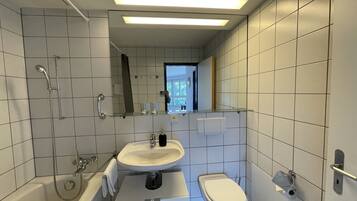 Combined shower/tub, hair dryer, towels, soap