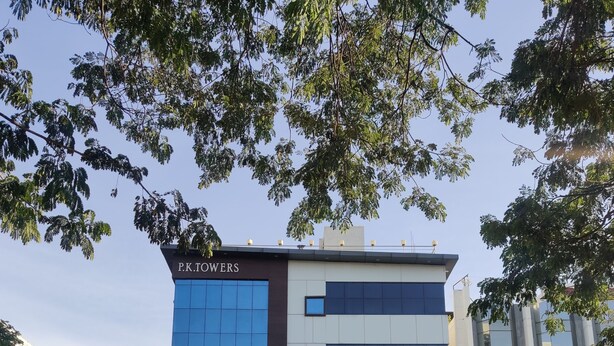 A multi-story building with signage for P.K. Towers, P.K. Coffee Shop, and P.K. Residency. - P K Rresidency (Madurai)