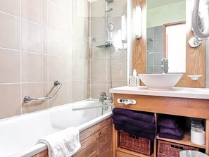 Bathtub, hair dryer, towels