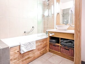 Bathtub, hair dryer, towels