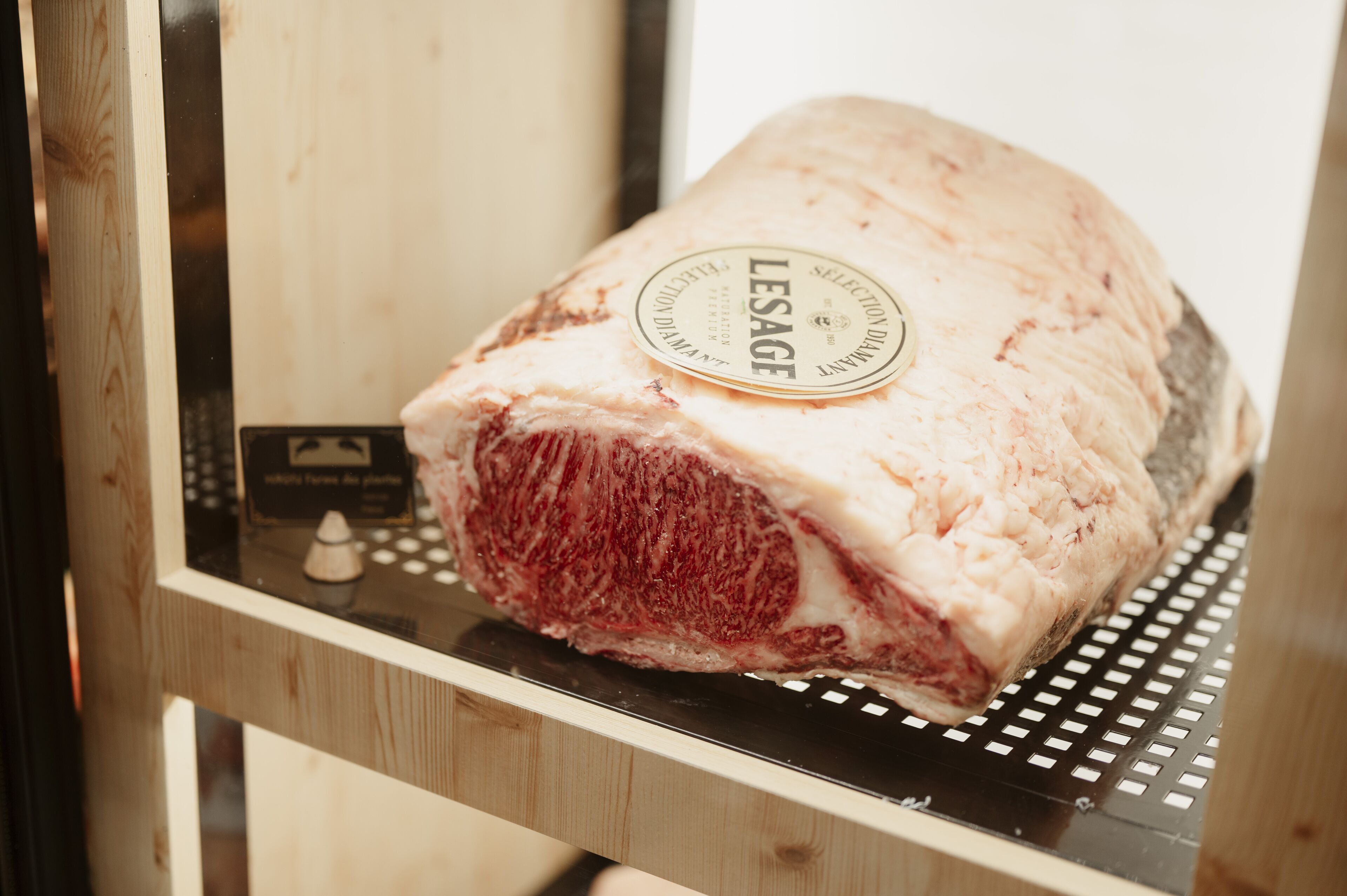 A large piece of meat with a label that reads "LESAGE."