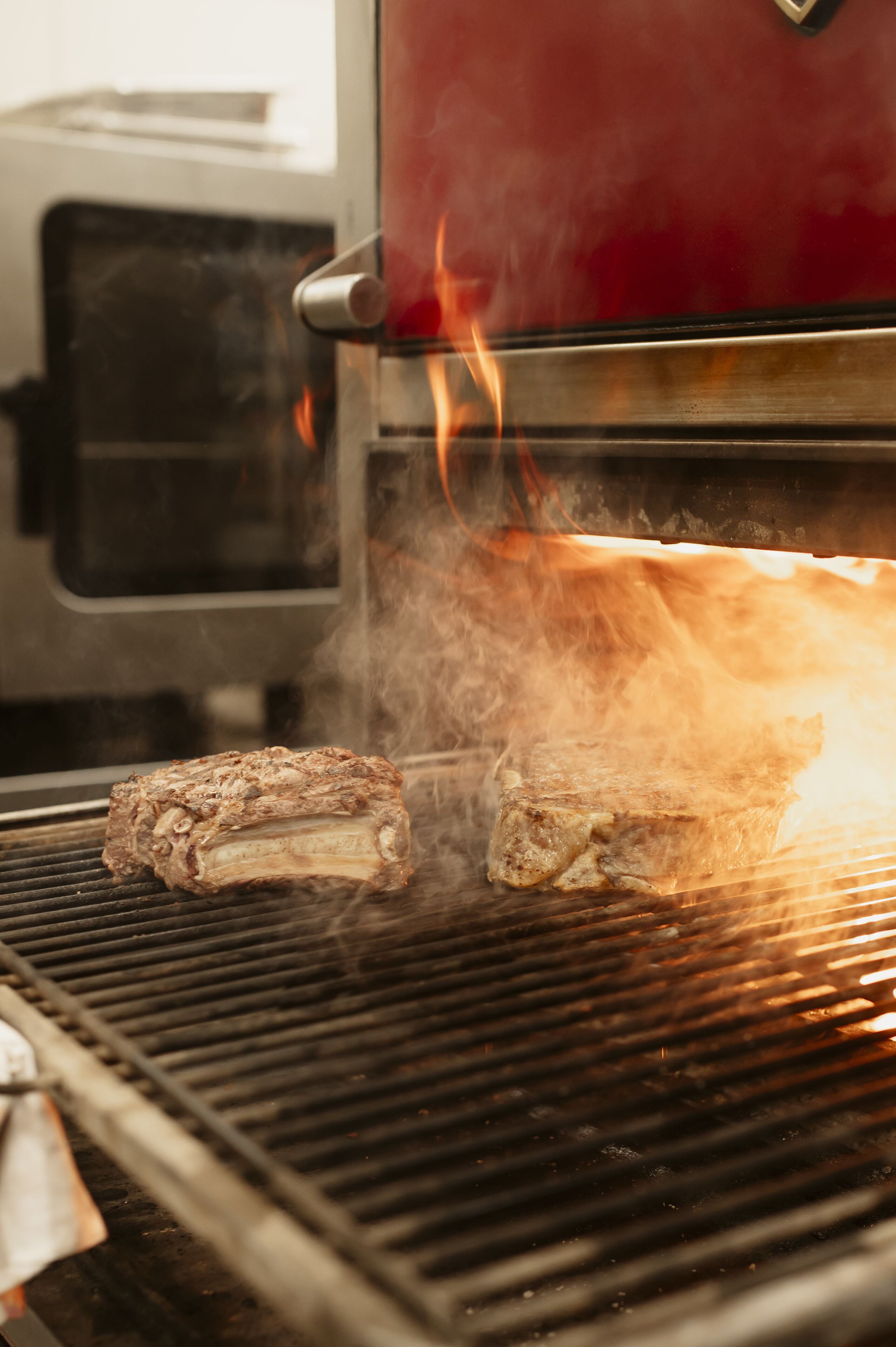 A grill with meat being cooked.
