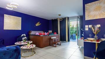 Romantic Apartment | Living area | 140-cm Smart TV with cable channels, TV, Netflix