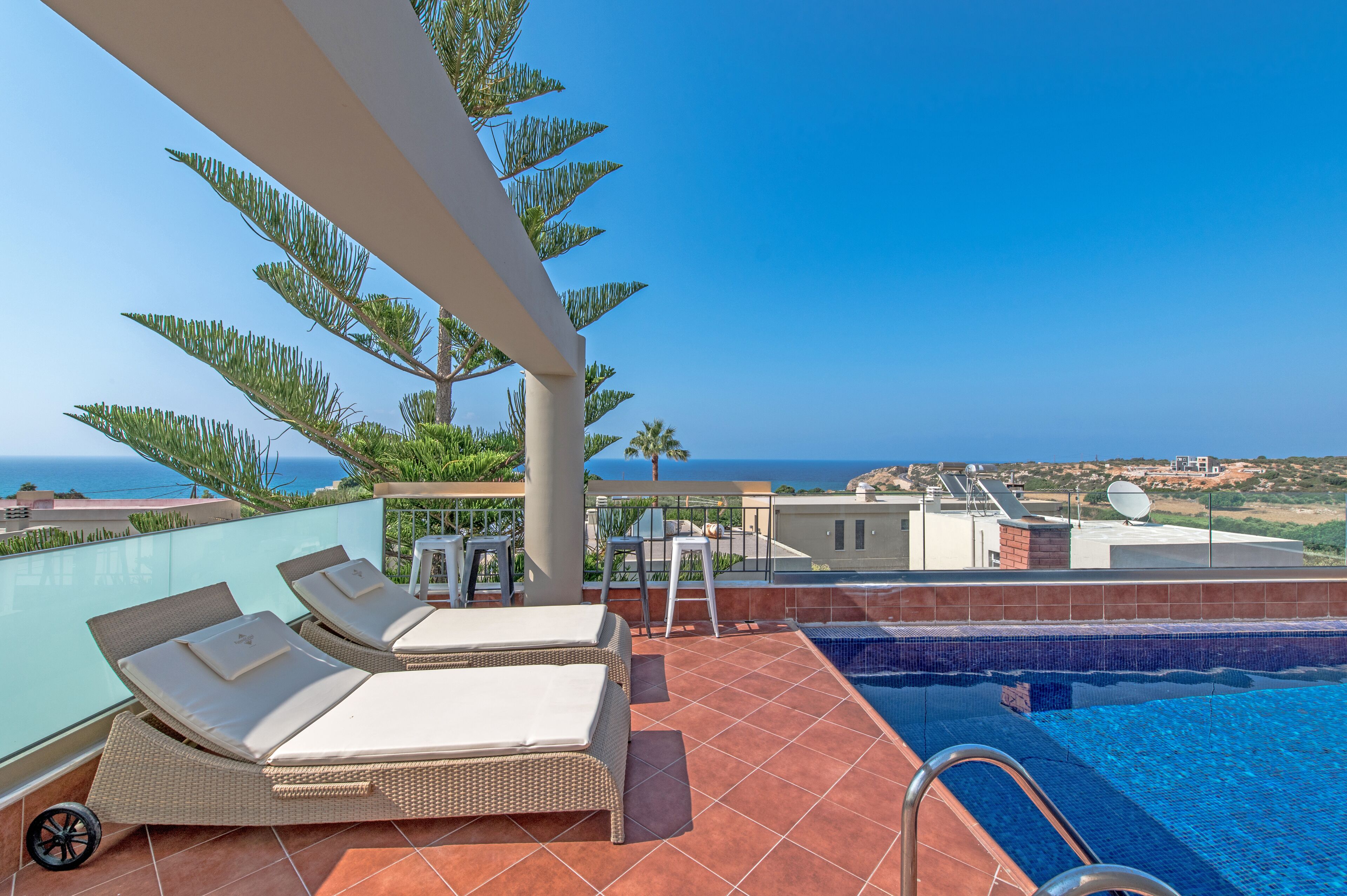 Seasonal outdoor pool, pool loungers