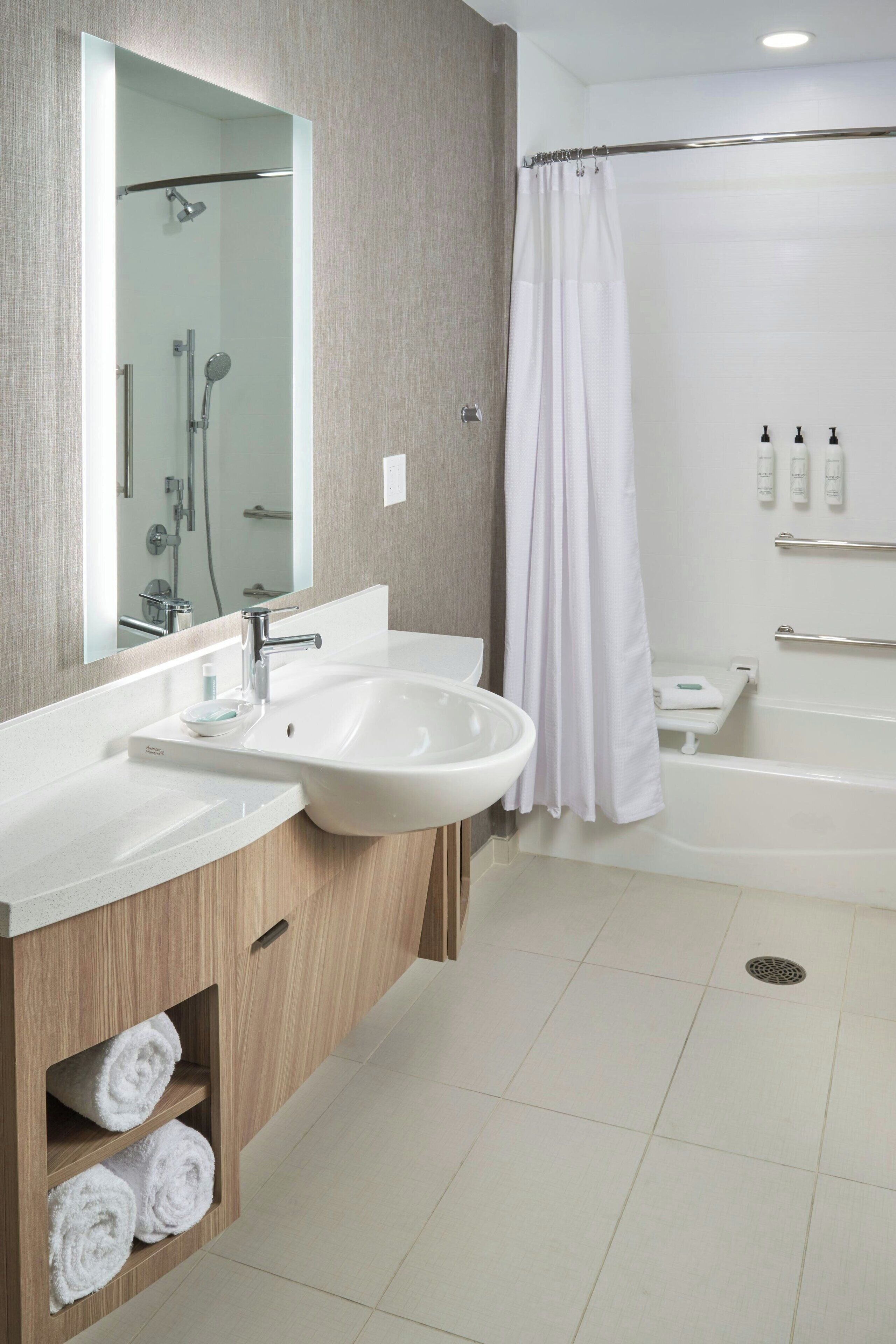 shower, rainfall showerhead, hair dryer, towels