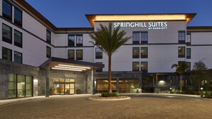A modern hotel entrance with a sign reading "Springhill Suites by Marriott".