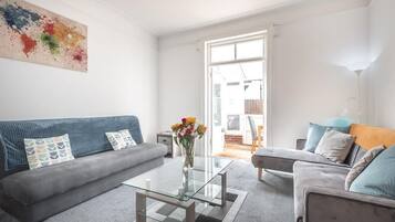 City Apartment | Living area | 40-inch Smart TV with digital channels, TV