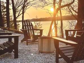 A lakeside seating area with Adirondack chairs and a fire pit. - The BL Cottage - Lake Getaway with Panoramic Views, near Cascade Mountain (Montello)