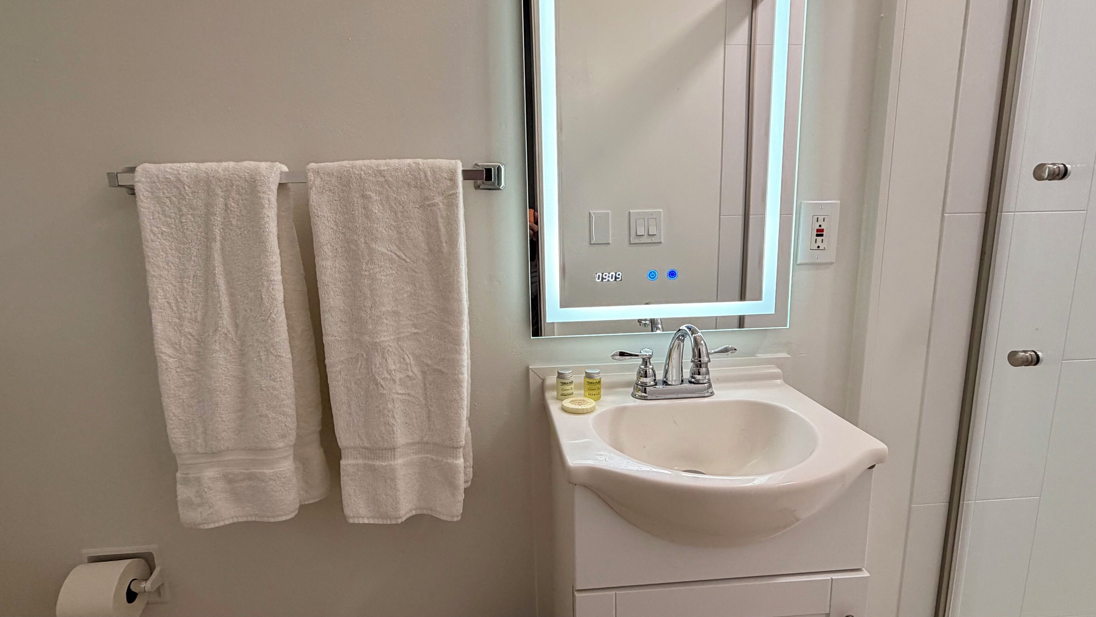Shower, hair dryer, towels, soap