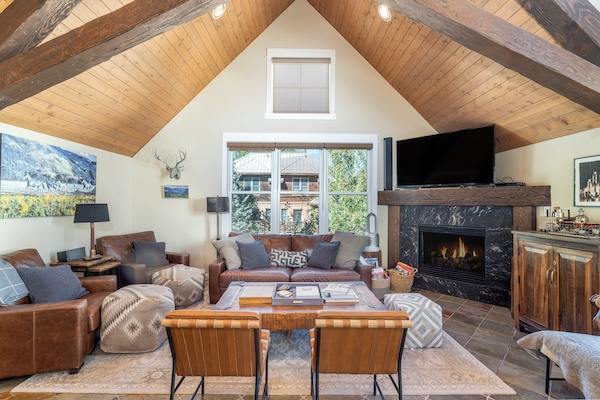 Such a cozy gathering spot in the great room with a fireplace.