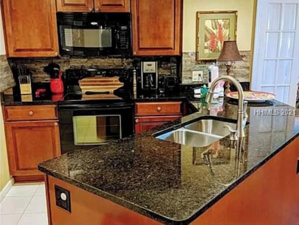 Fridge, microwave, stovetop, cookware/dishes/utensils