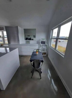 Enjoy cooking in this kitchen with an oven and a view of the outdoors.