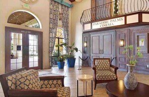Relax in the spacious seating area with a round table and take in the view from the large arched window.