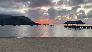 A beach with a pier and boats. - Heavenly Hanalei Home in Tropical Paradise (Hanalei)