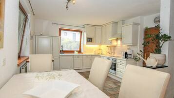 Microwave, oven, dishwasher, dining tables