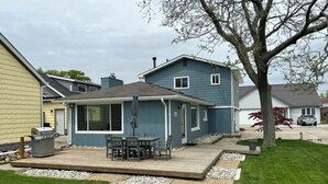 A residential property with a deck, a patio area, and a lawn. -  Cabana Bay Fish Camp, Lake St. Clair- Minutes to Anchor Bay (Clay Township)