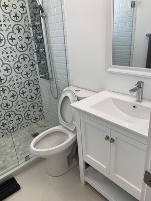 Shower, hair dryer, towels, soap