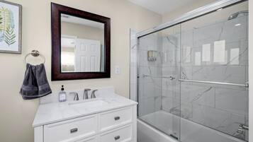 Combined shower/bathtub, hair dryer, towels, soap