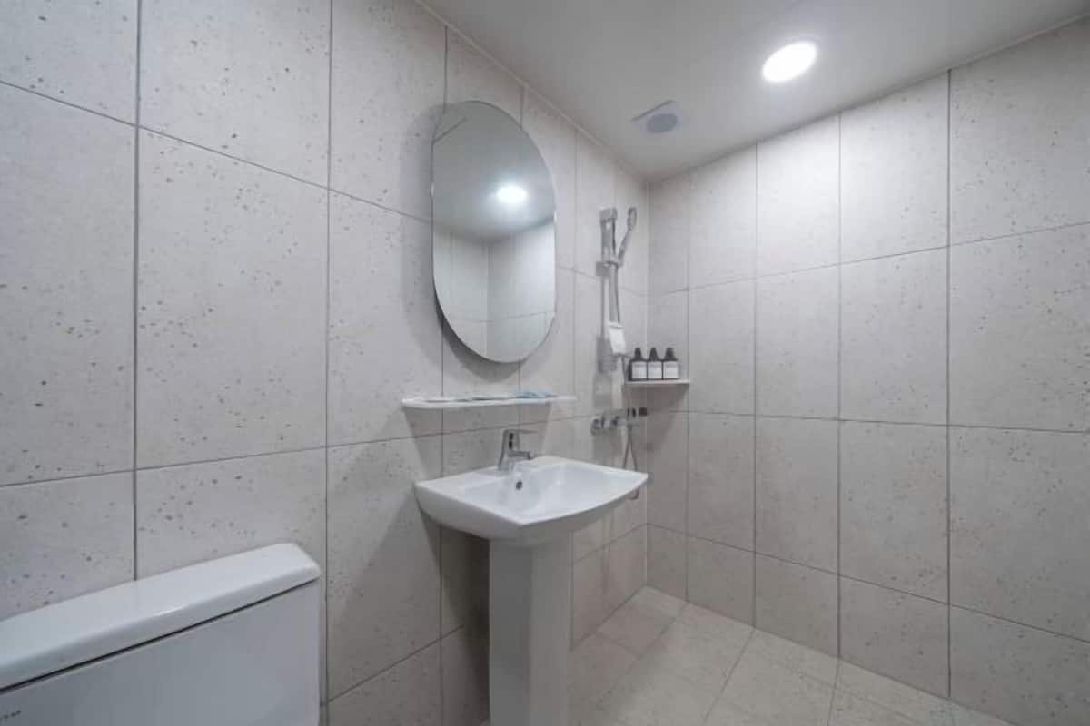 Bathroom | Shower, hair dryer, slippers, towels