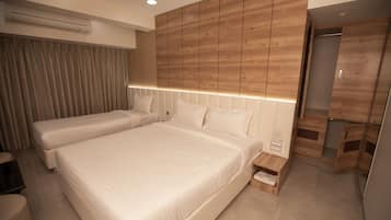 Habitación triple ejecutiva | Ropa de cama de alta calidad, colchones viscoelásticos, minibar