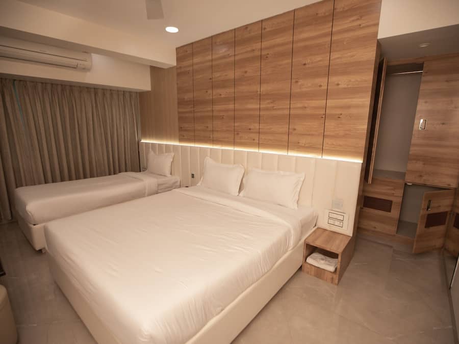 Quarto triplo executivo | Roupas de cama premium