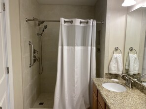 Combined shower/tub, hair dryer, towels, soap